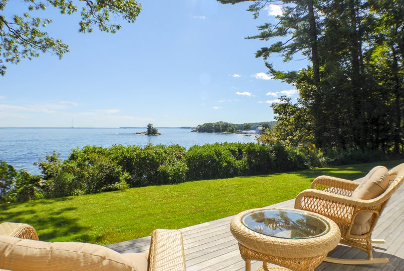 Coastal home deck with ocean view near Camden Maine with outdoor seating