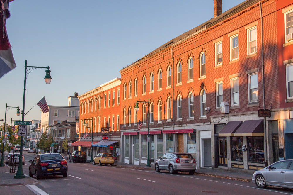 Downtown Rockland Maine with historic brick buildings, shops, and street view