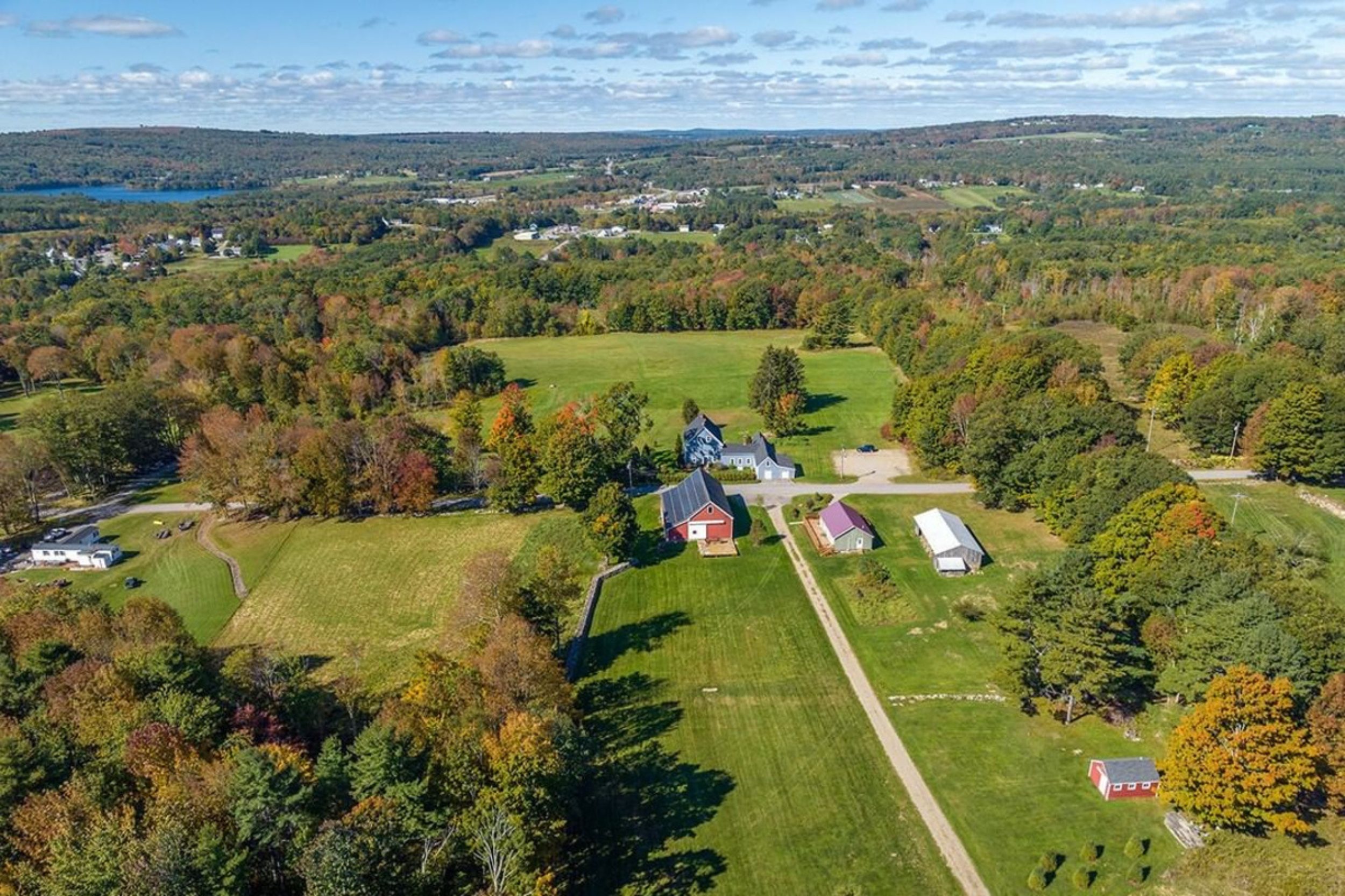 Aerial view of farmland, homes, and rolling countryside in Union Maine