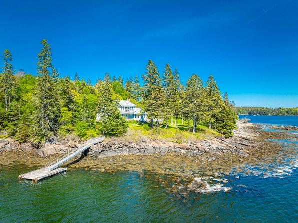 Waterfront home in Cushing Maine with private dock and rocky shoreline