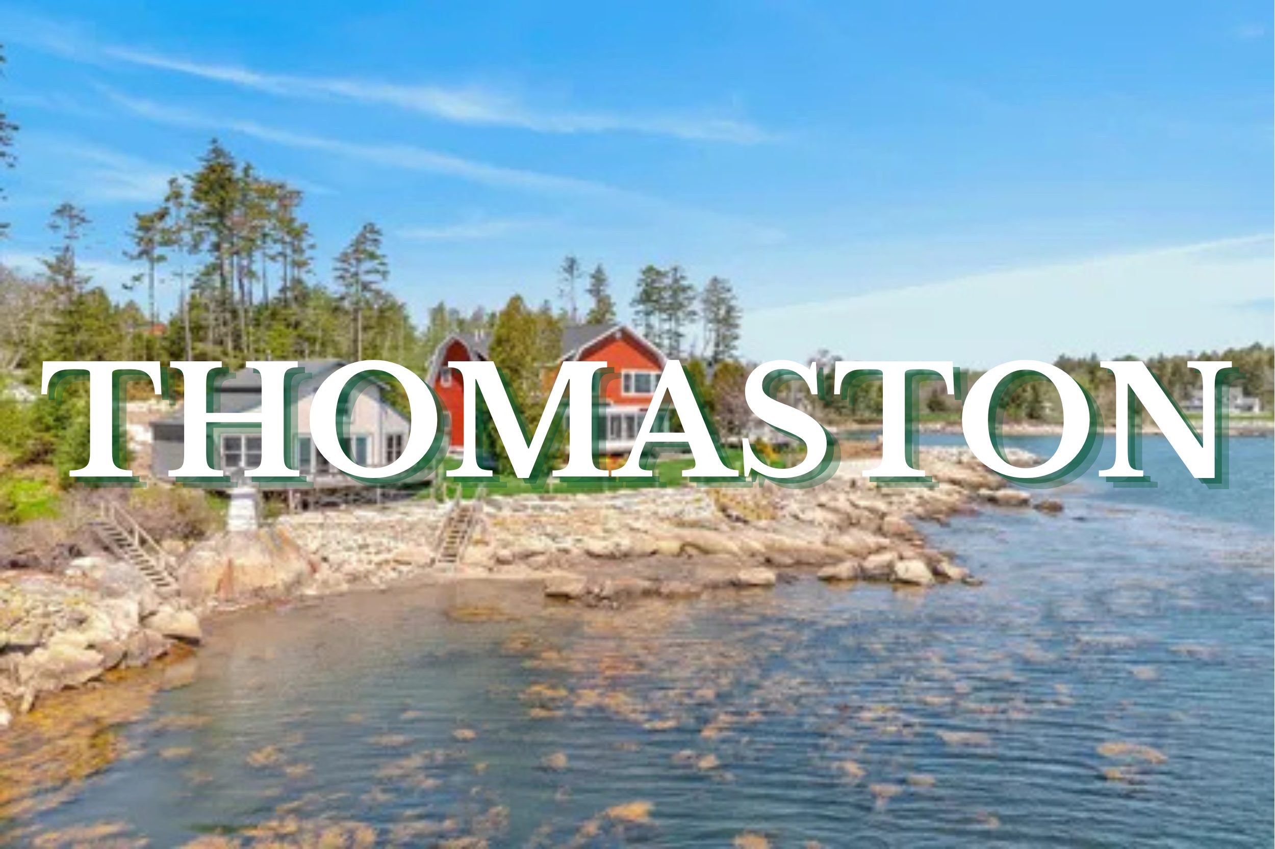 Waterfront homes along the rocky shoreline in Thomaston, Maine with ocean views