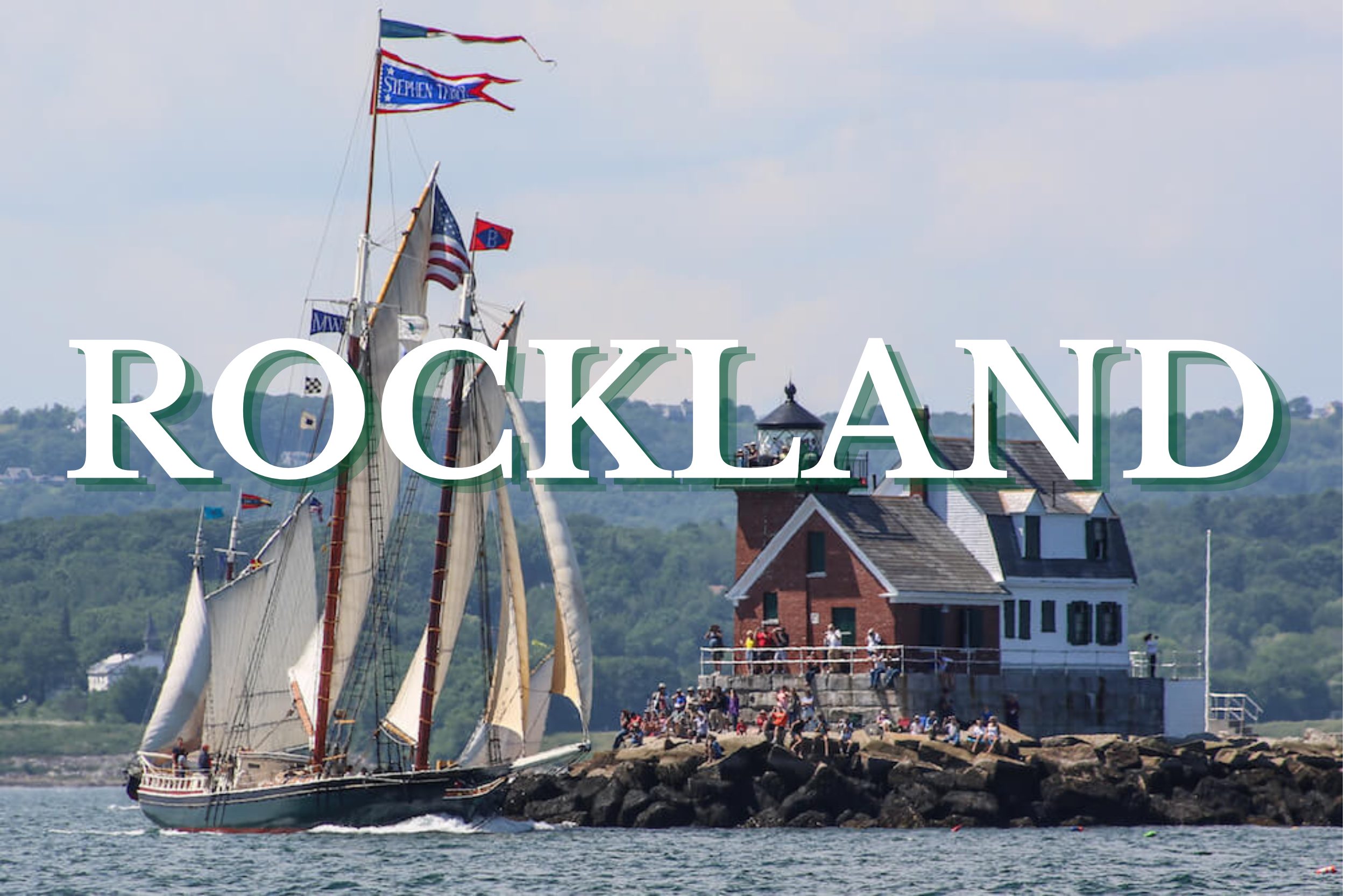 Classic schooner sailing past Rockland Breakwater Lighthouse in Rockland, Maine