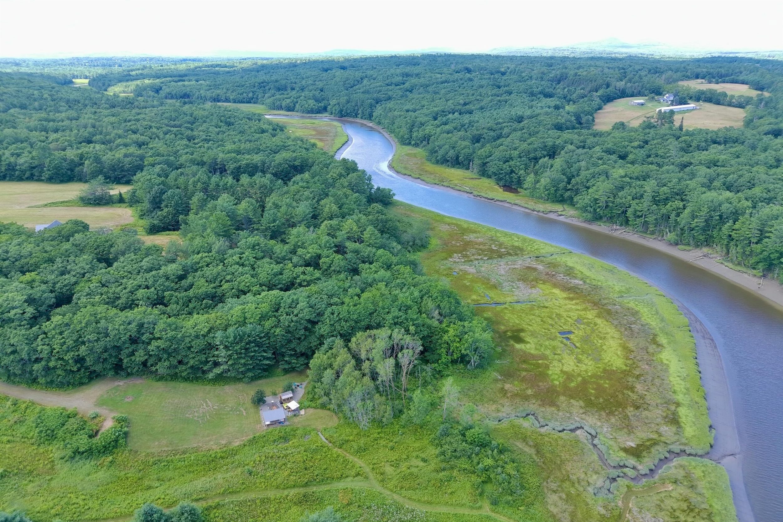 Aerial view of the St. George River winding through forests and marshland near Thomaston Maine
