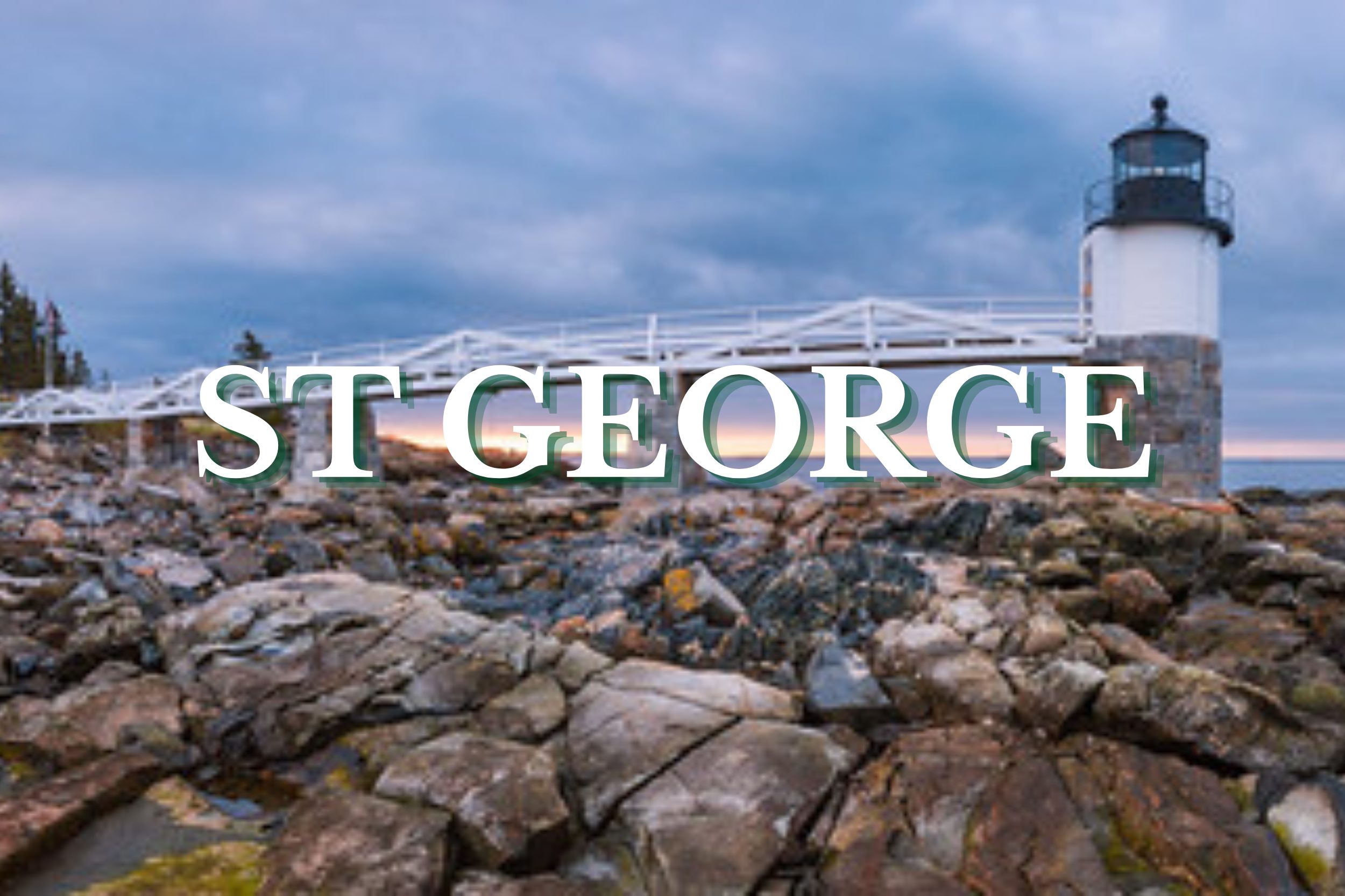 Rocky shoreline with a coastal lighthouse and dramatic sky in St. George, Maine