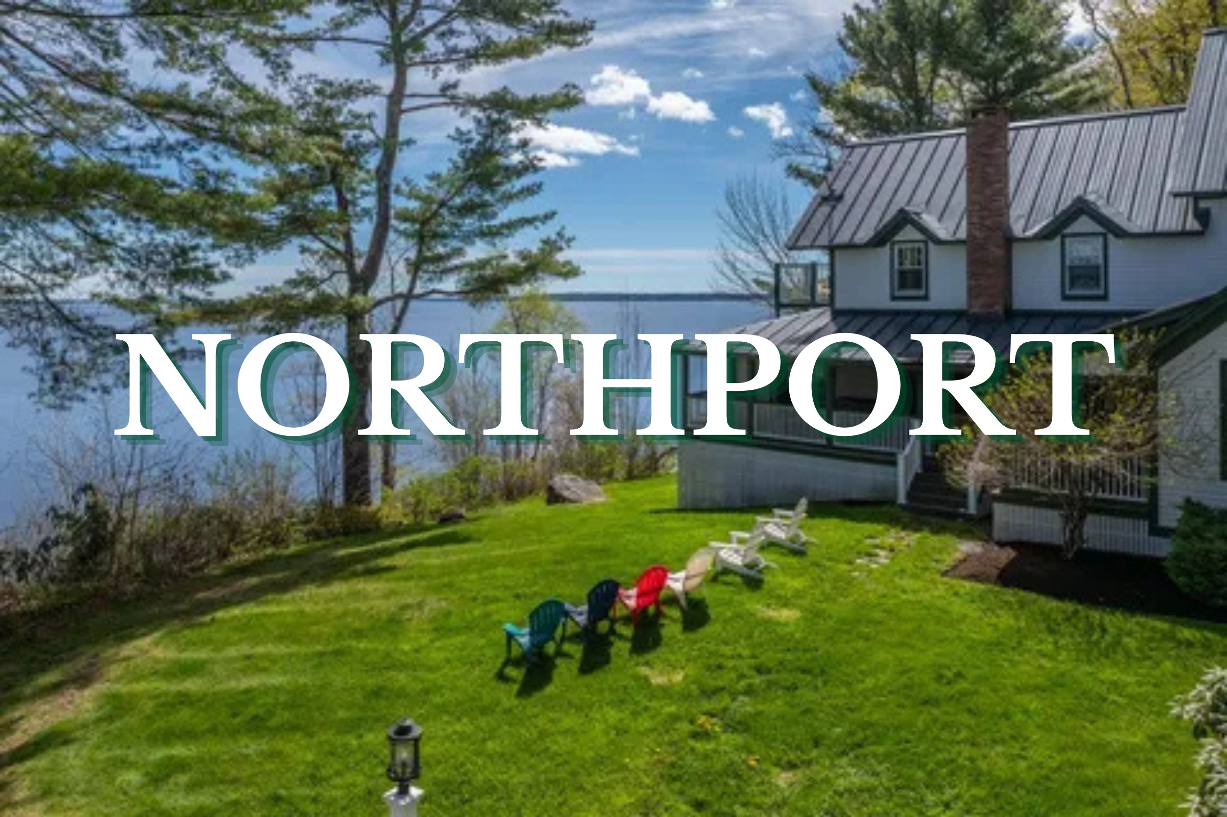 Coastal home with a large green lawn overlooking the water in Northport, Maine